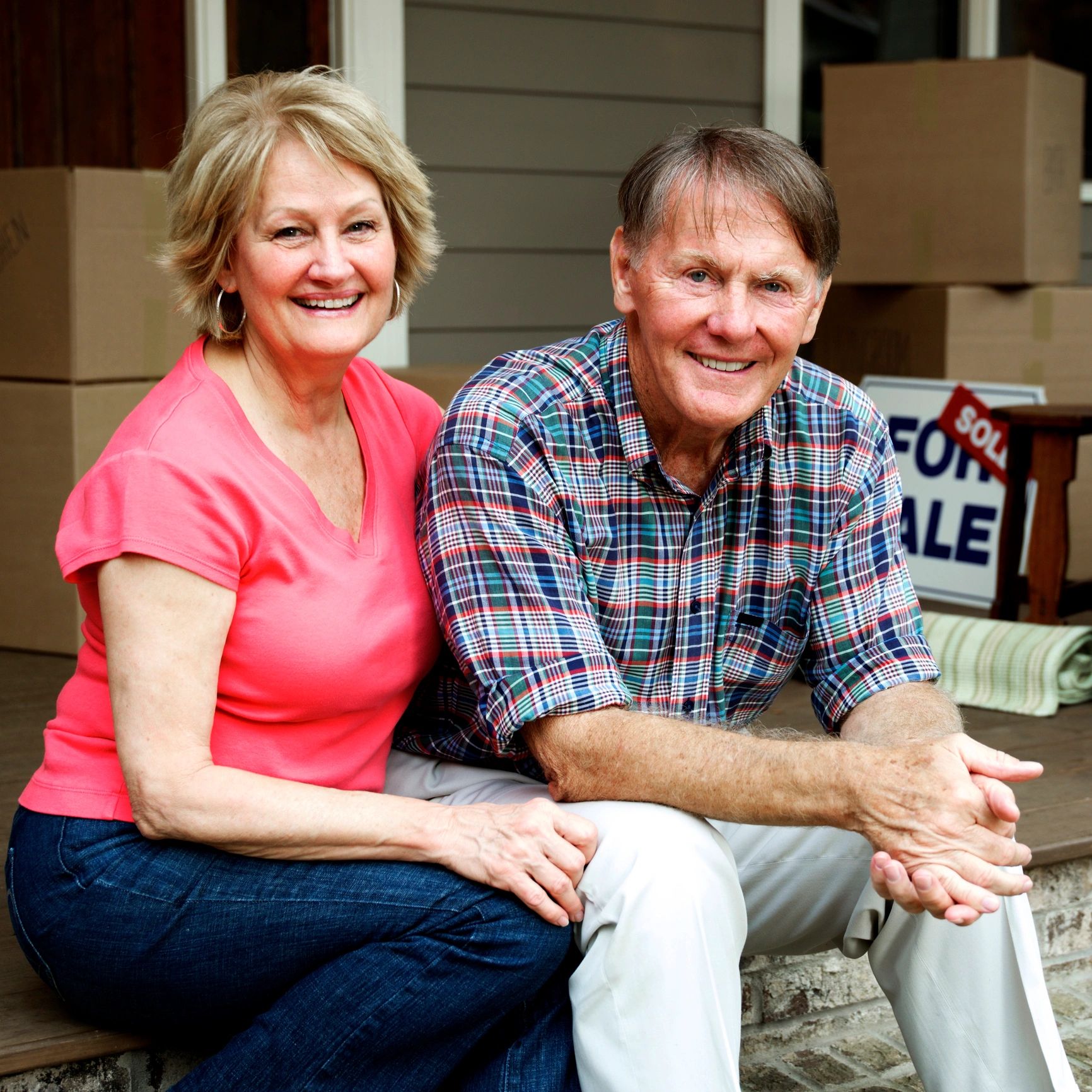 Senior couple outside home