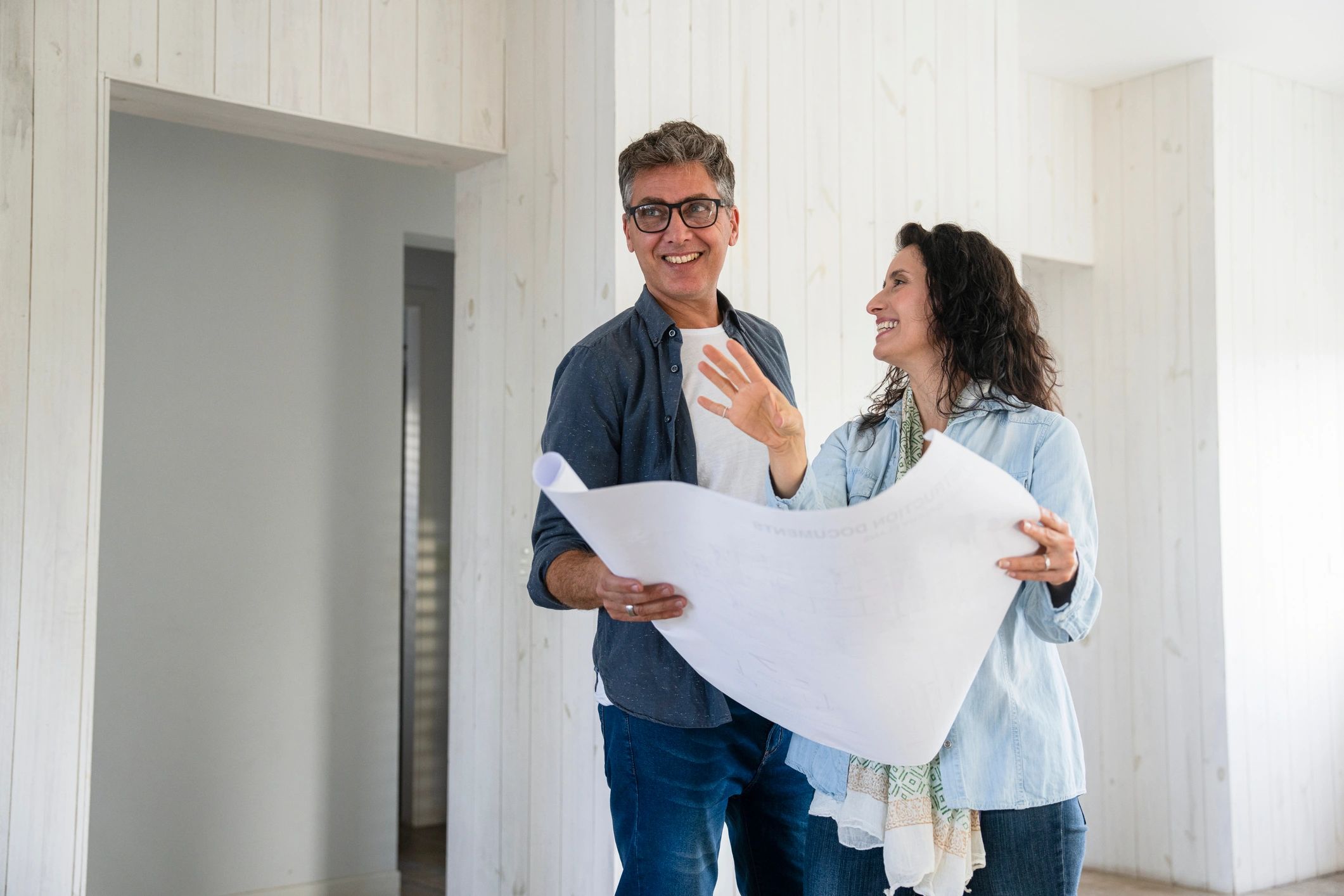 Couple planning a move and reviewing housing options