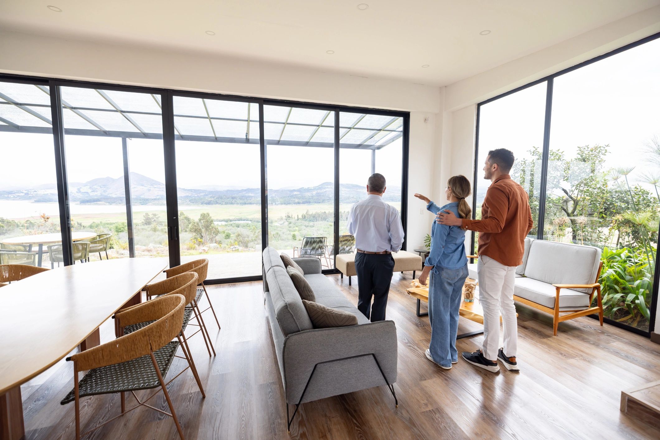 Couple reviewing a home sale with a real estate agent